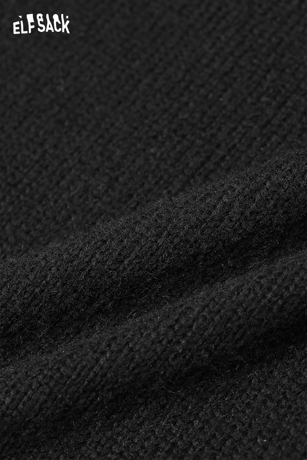 Close-up of textured black fabric for ELFSACK fringe hem long skirt showcasing softness and quality