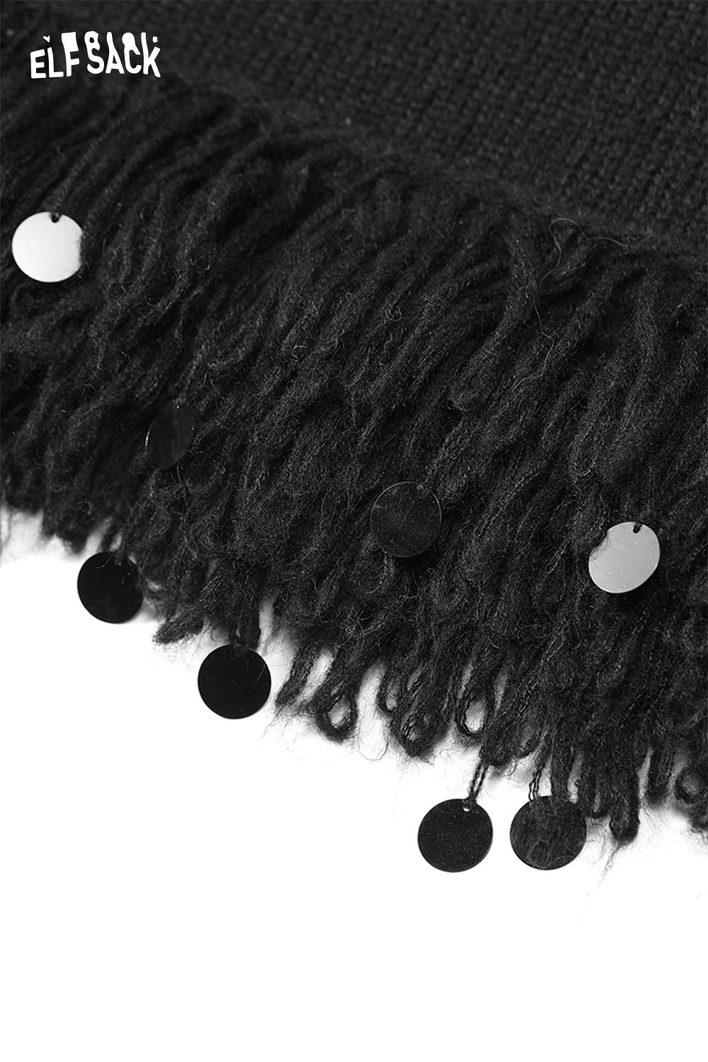 Close-up of ELFSACK fringe hem long skirt featuring decorative fringes and shiny details