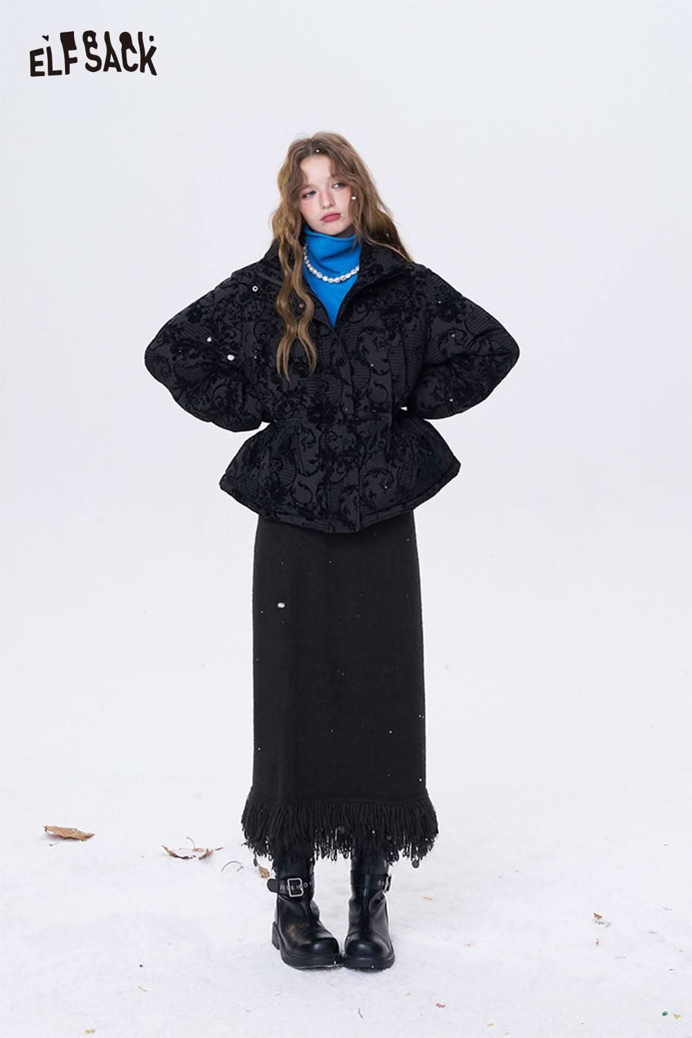 ELFSACK fringe hem long skirt in black paired with a stylish jacket for a trendy winter look