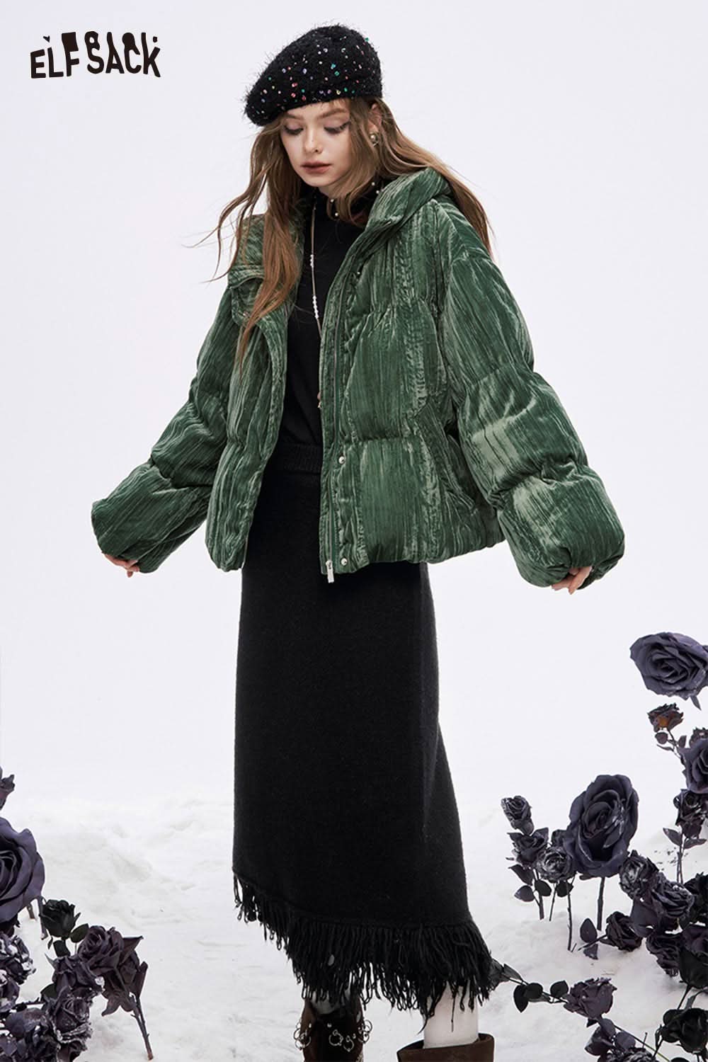 ELFSACK fringe hem long skirt in black, paired with a green puffer jacket for a stylish winter look