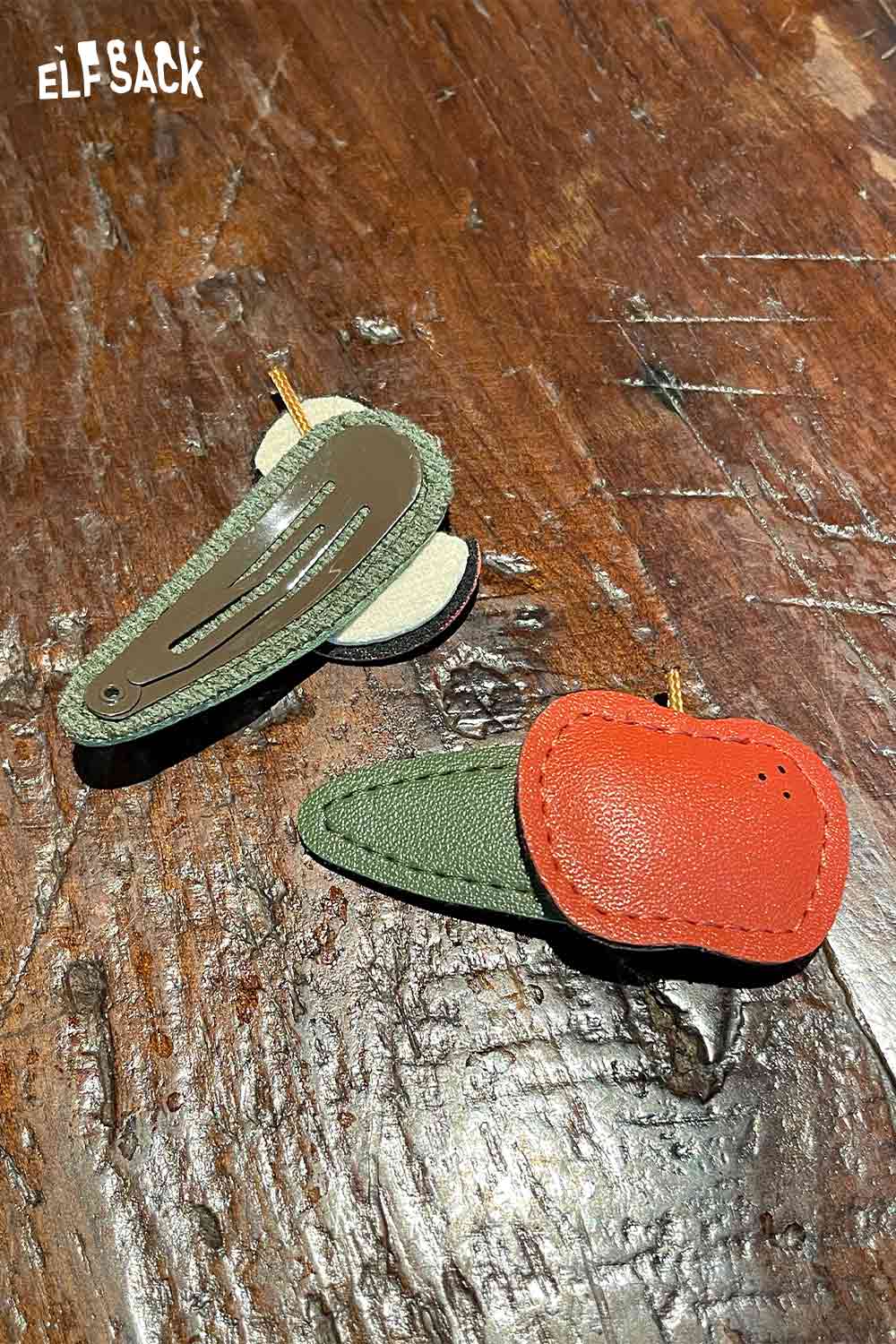 Genuine leather fruit hairpin featuring a red apple and green leaf design from ELFSACK