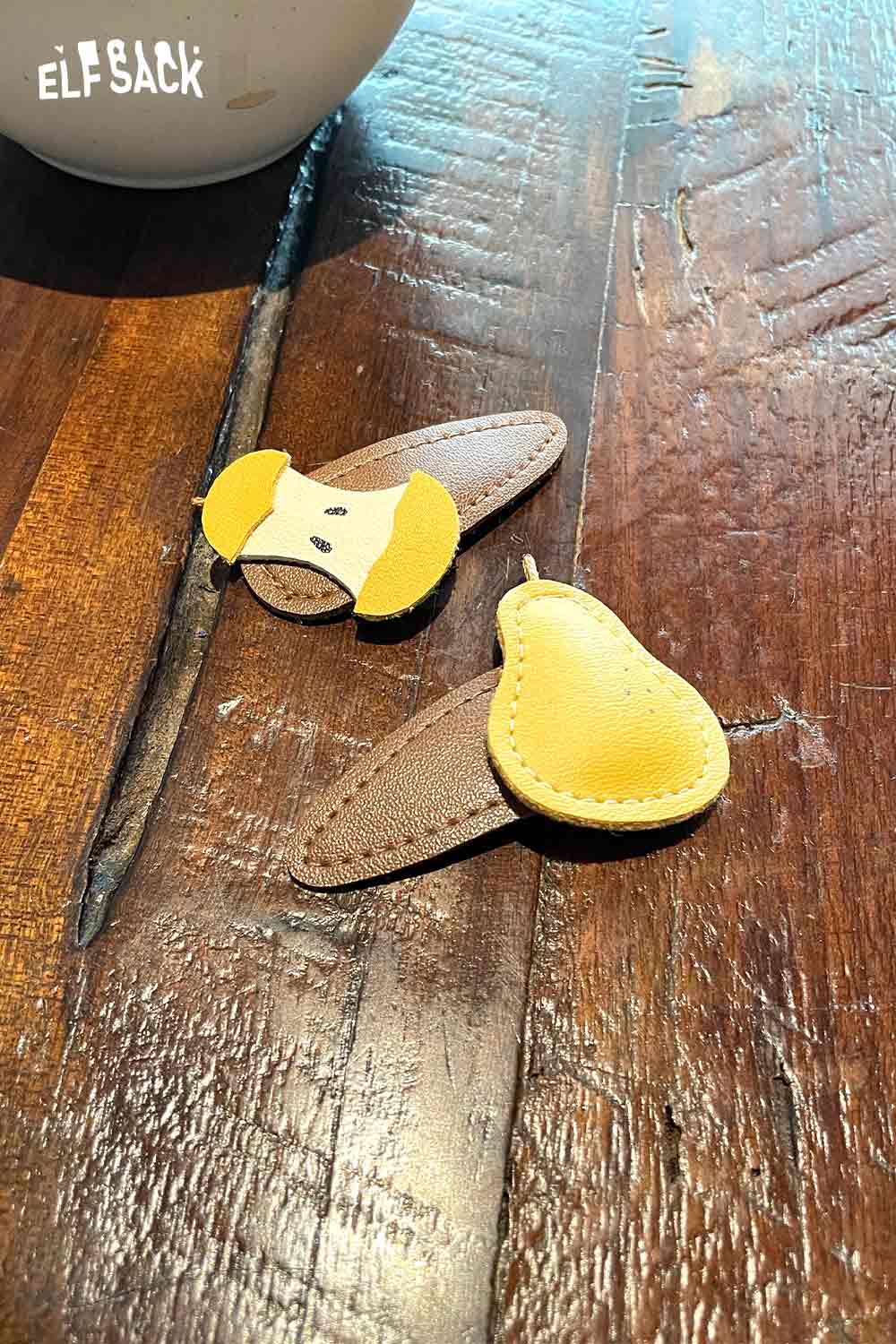 Genuine leather fruit hairpin set in fun fruit designs featuring a pear and a playful dog face