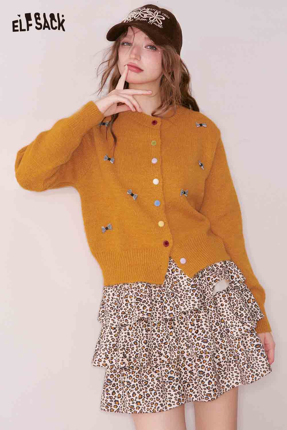 ELFSACK girly bow cardigan in mustard yellow with colorful buttons and playful bow details