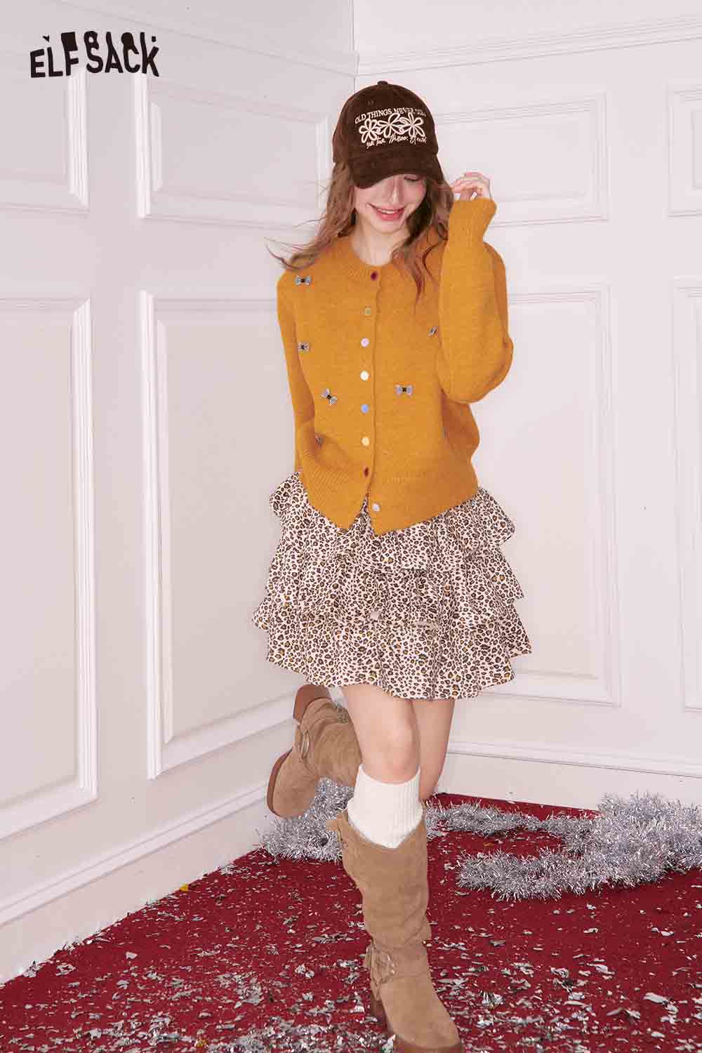 ELFSACK girly bow cardigan in mustard with buttons, paired with a ruffled leopard print skirt