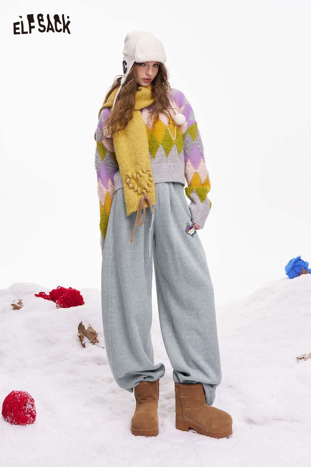 ELFSACK heart embroidery wide leg pants in gray, styled with a colorful sweater and winter accessories