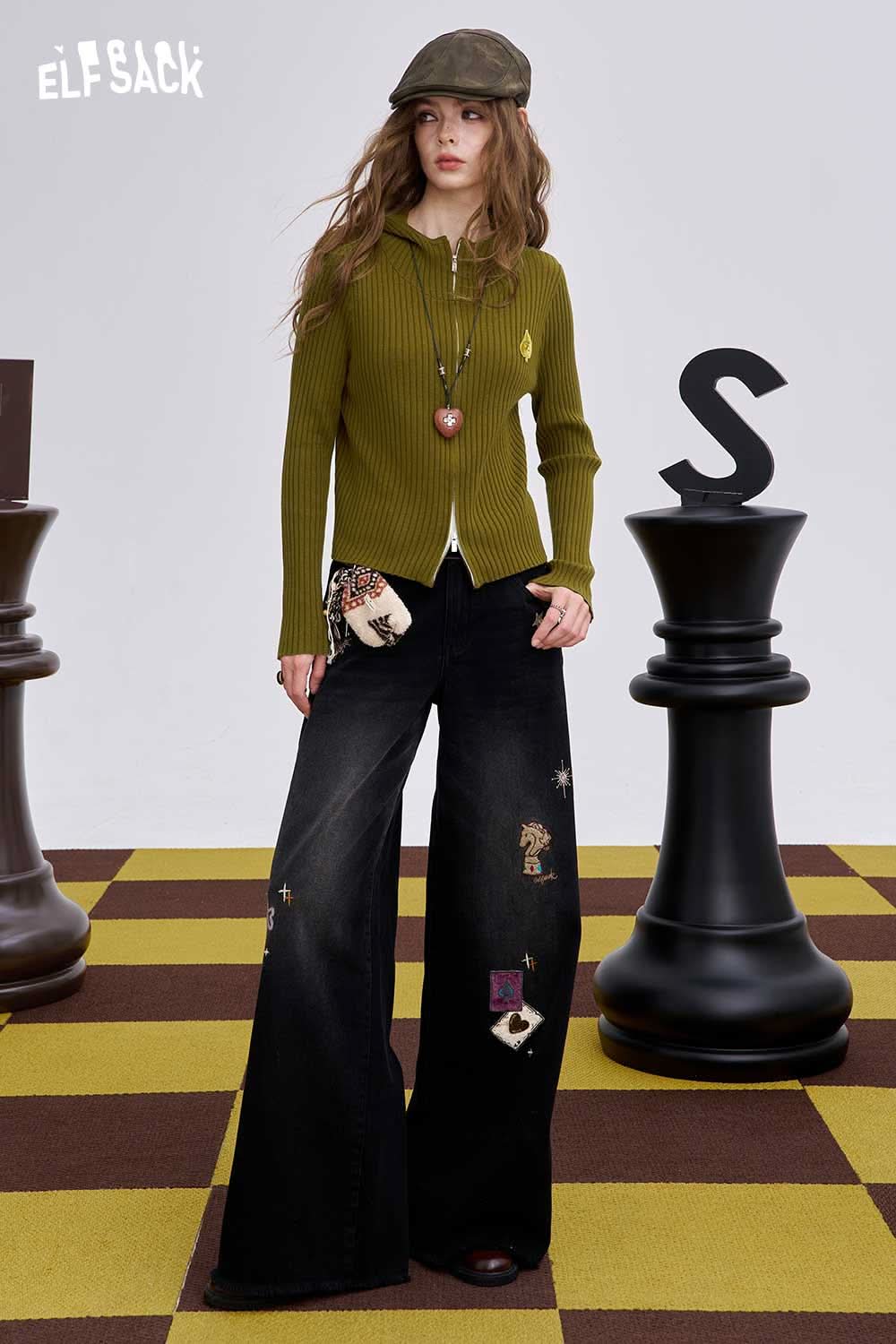 ELFSACK heart print knit sweater in olive green paired with wide-leg jeans for a trendy look