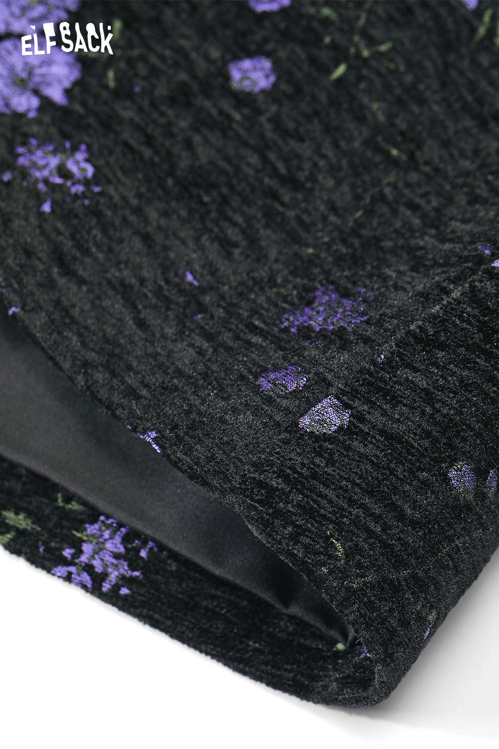 Close-up of ELFSACK high waist floral A line skirt featuring a textured black fabric with purple flowers