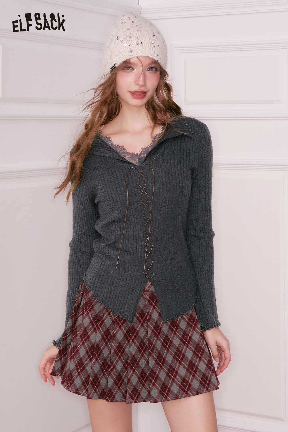 Stylish ELFSACK lace collar knitwear for women paired with a plaid skirt and a cozy beanie