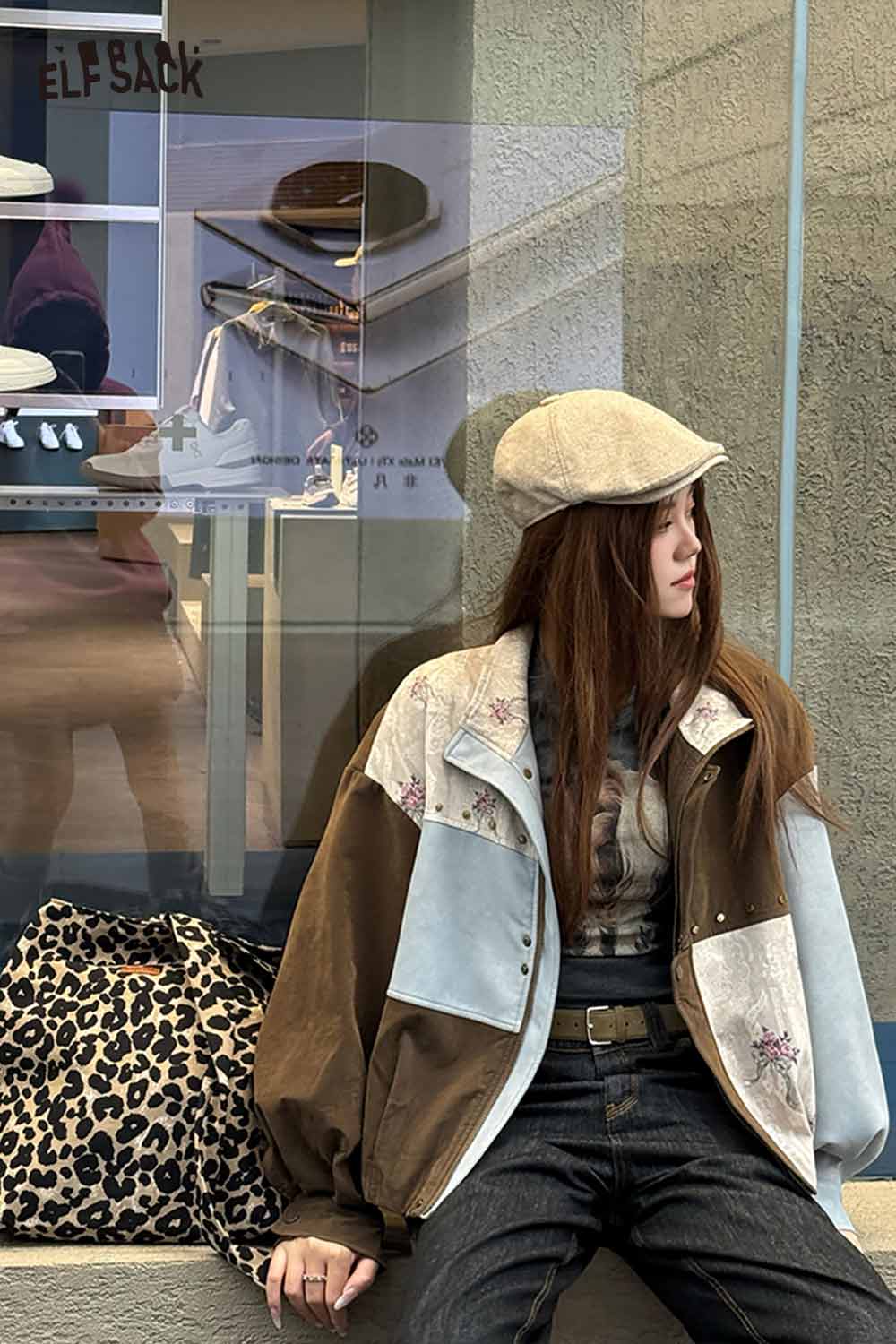 ELFSACK leopard print crossbody bag placed next to a model in stylish apparel, showcasing trendy accessories