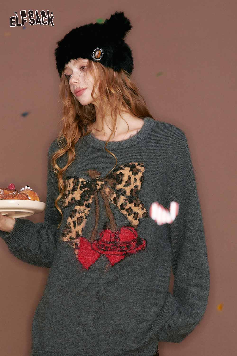 ELFSACK leopard print graphic sweater featuring a bow design and soft fabric for cozy style