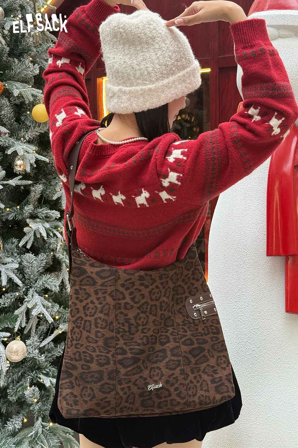 ELFSACK leopard print suede crossbody bag styled with a cozy red sweater during winter season