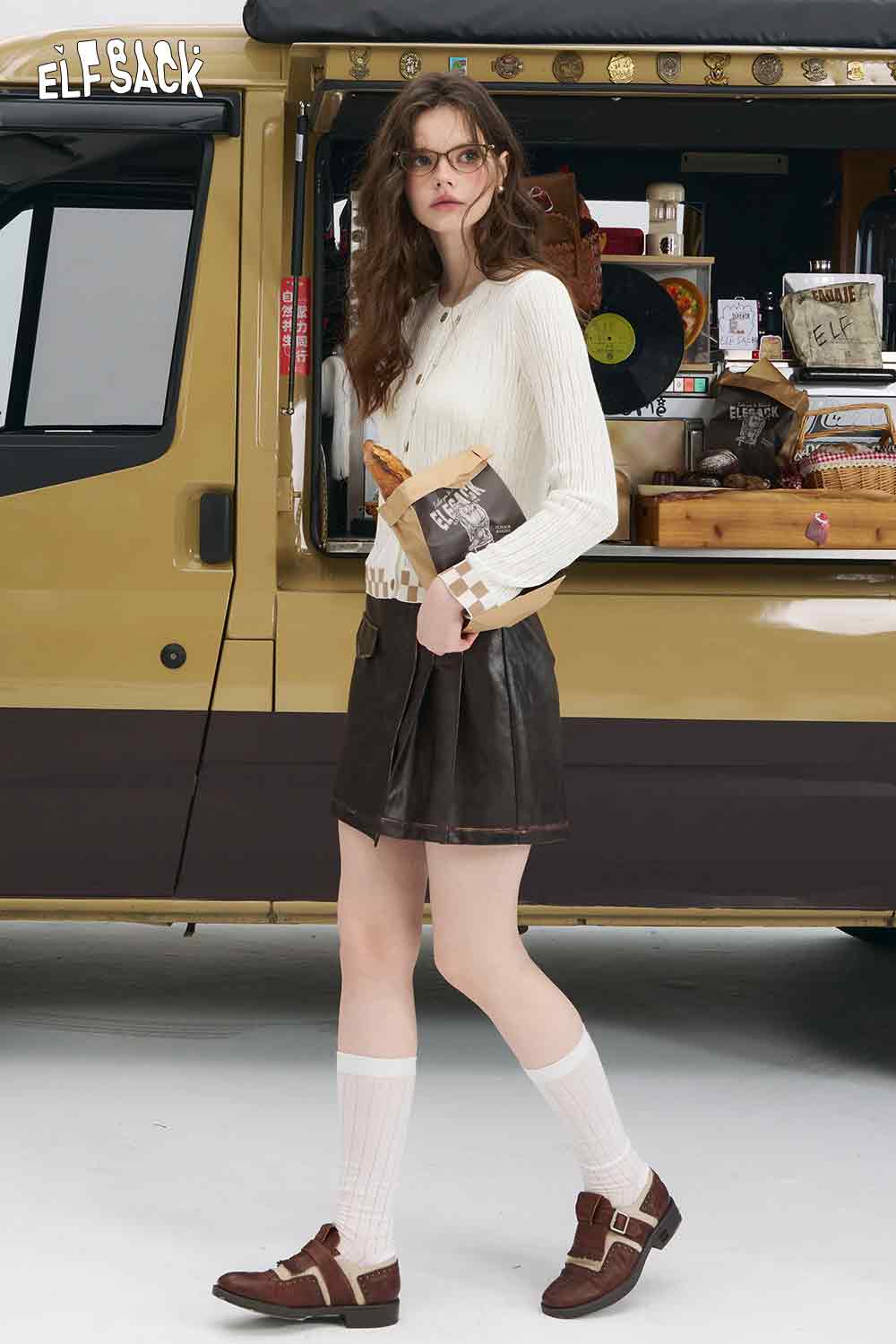 ELFSACK mint checkered knit cardigan on model with brown mini skirt knee socks and loafers by camper van