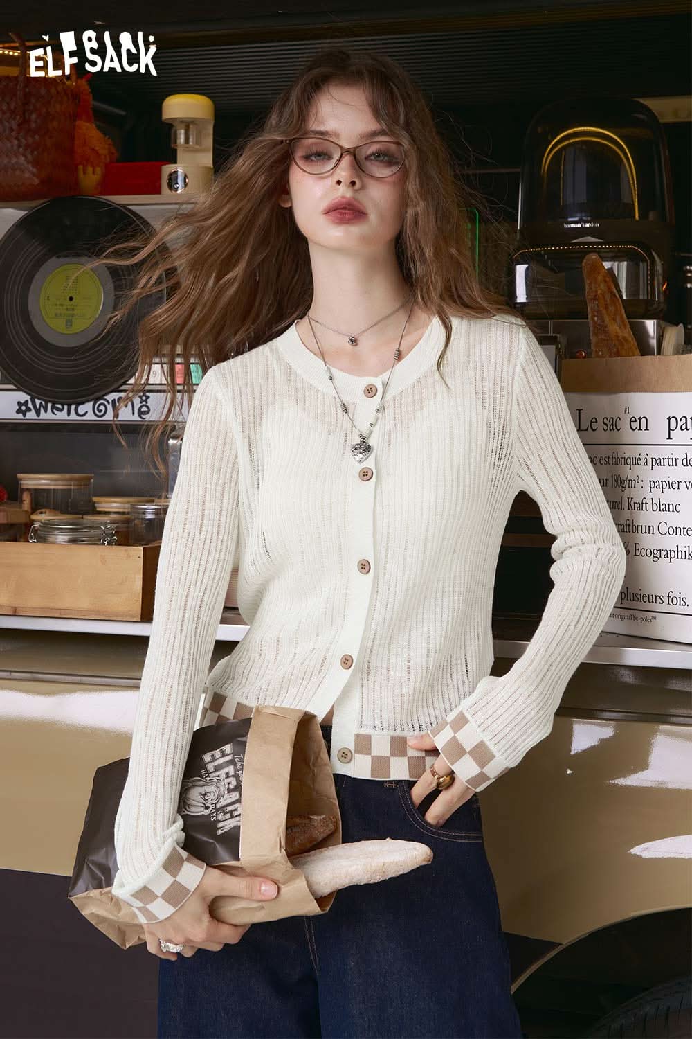 ELFSACK model wearing mint checkered knit cardigan ribbed button front long sleeves checkered cuffs and hem styled with jeans