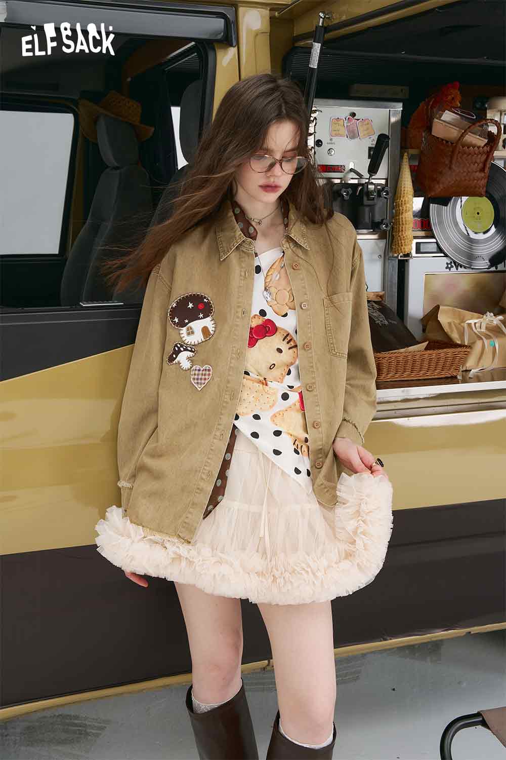 3D mushroom denim shirt for women on model wearing beige embroidered patch jacket over ruffled white skirt
