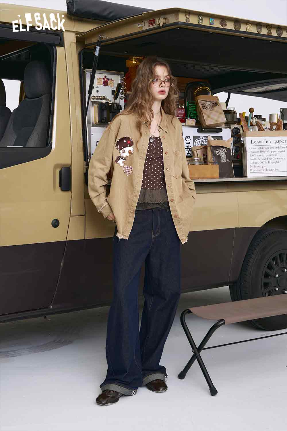 ELFSACK model wearing 3D mushroom denim shirt for women beige jacket with mushroom patch and wide leg jeans