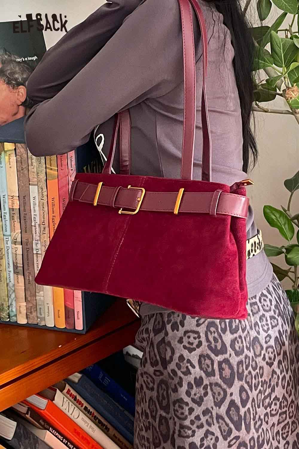 ELFSACK microsuede crossbody bag in burgundy featuring a stylish buckle and dual straps