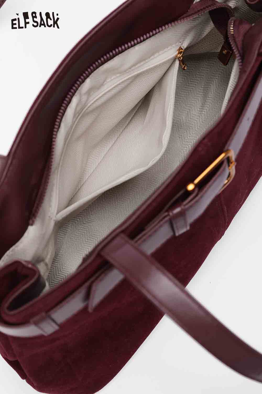 Interior of ELFSACK microsuede crossbody bag featuring ample space and a stylish design