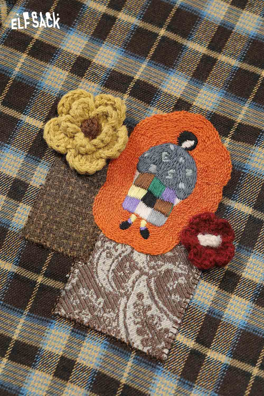 Close-up of ELFSACK minimalist 3D embellished long shirt featuring colorful floral and patterned appliques