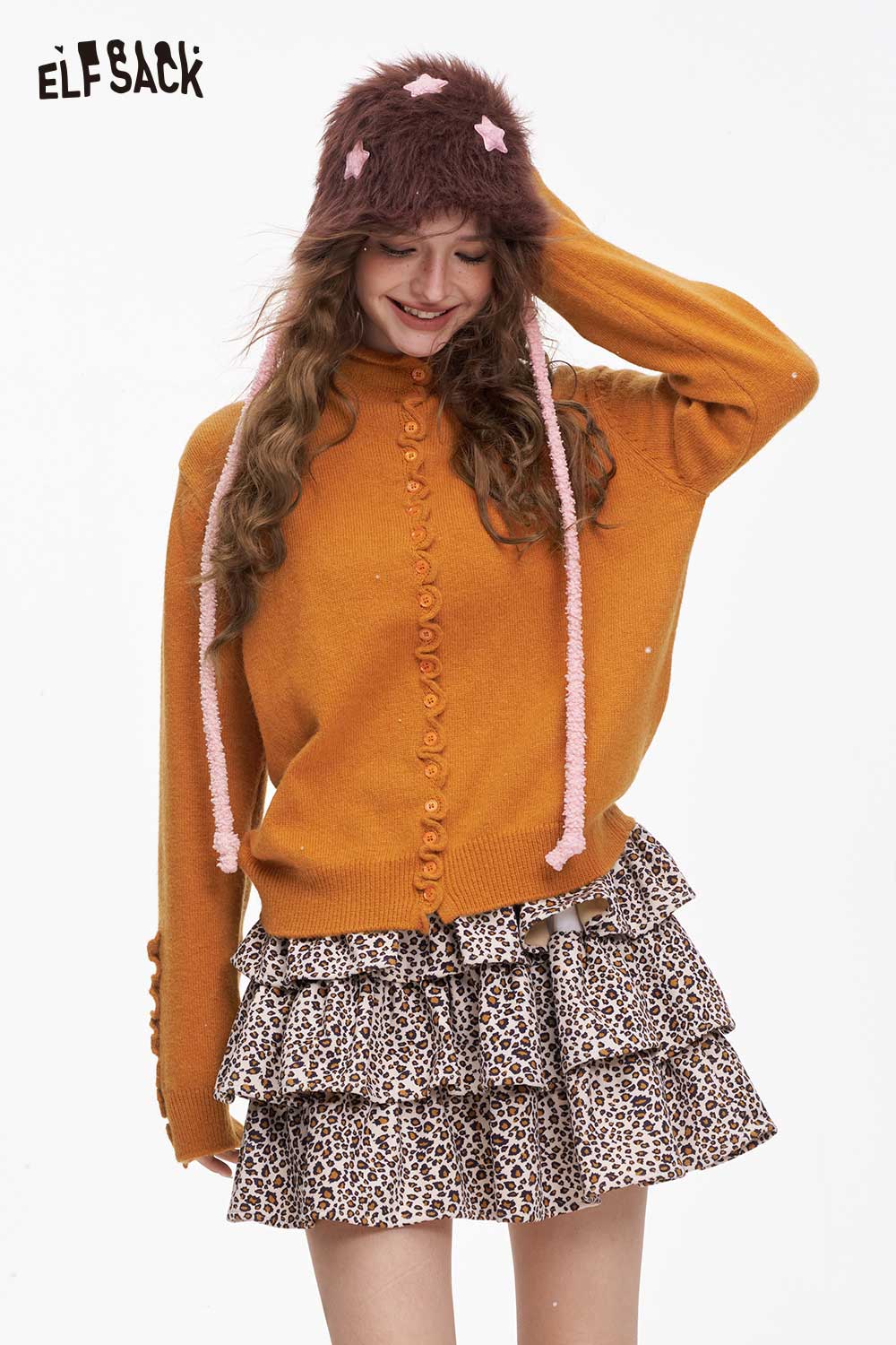 ELFSACK minimalist ruffle button knitwear in orange with cozy fit, paired with a leopard print skirt