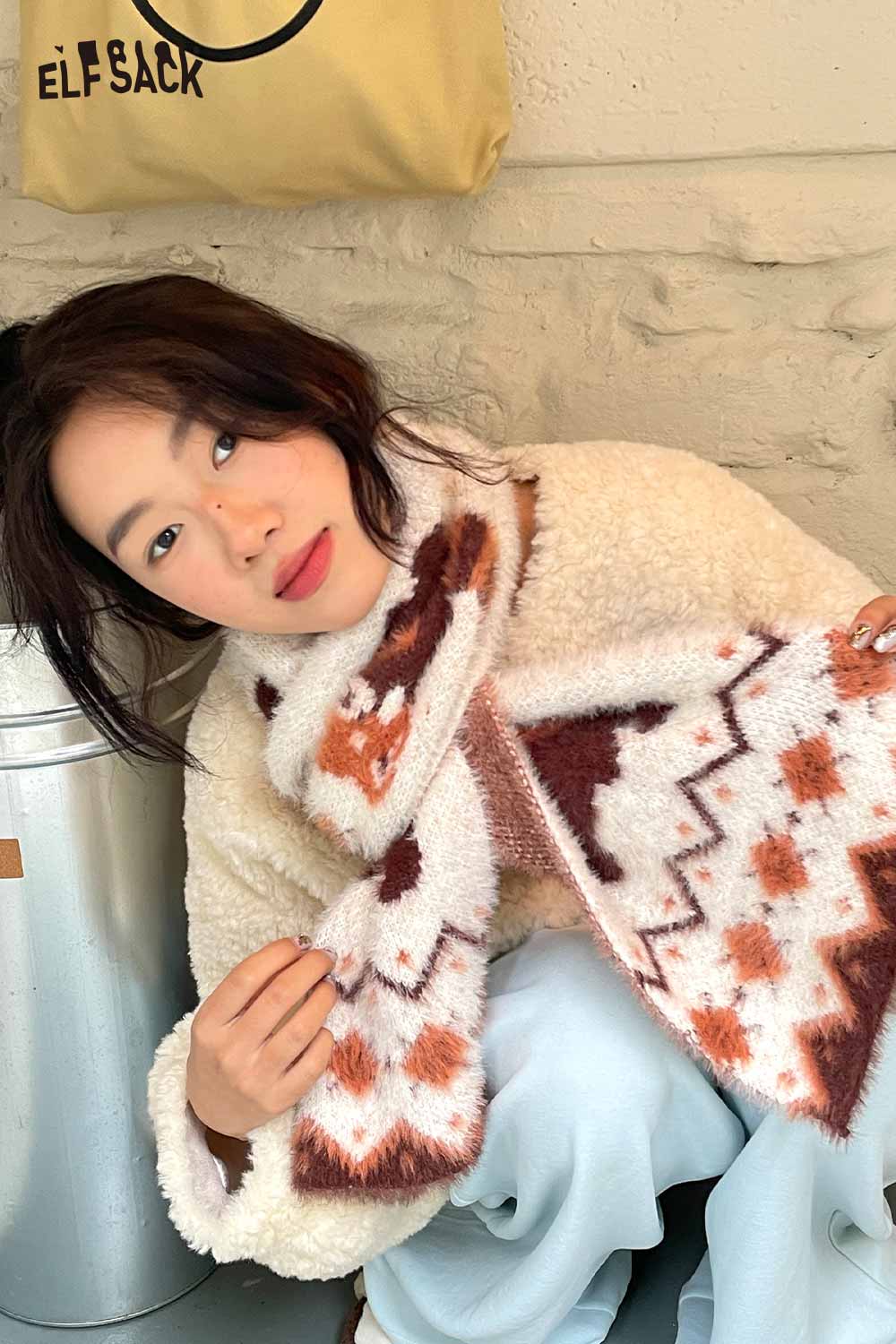 Cozy ELFSACK minimalist striped graphic scarf styled with a fluffy jacket for a fashionable look