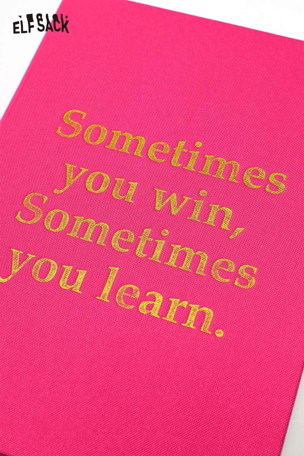 Pink hardcover notebook featuring a motivational quote hardcover notebook design with golden text