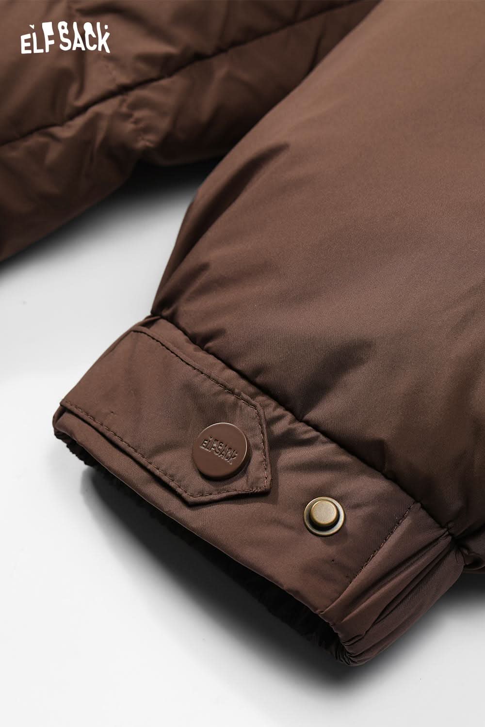 Close-up of ELFSACK women's longline puffer coat with stylish button detail on the cuff