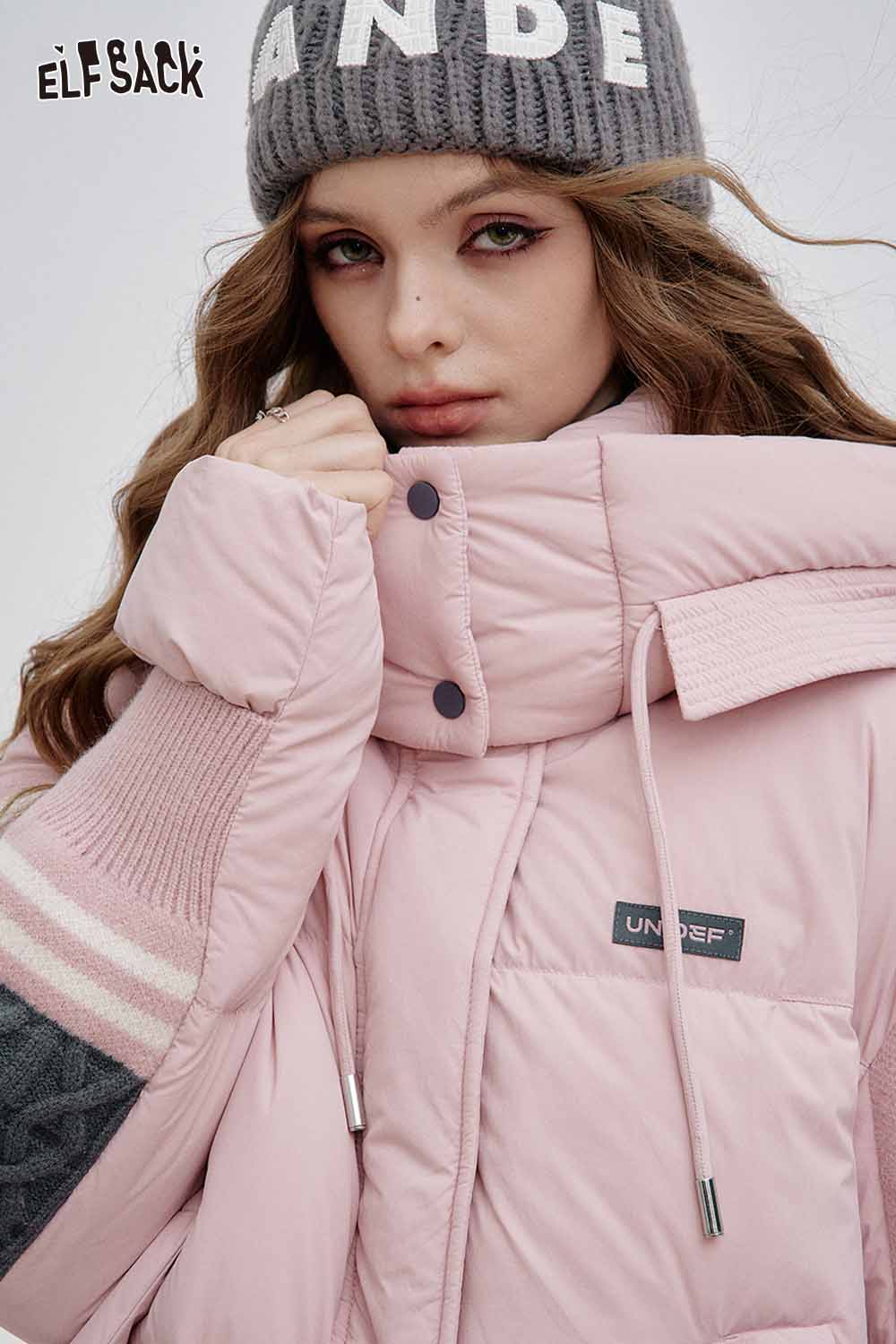 ELFSACK women wearing a stylish nylon collar down jacket for women in light pink color with cozy detail