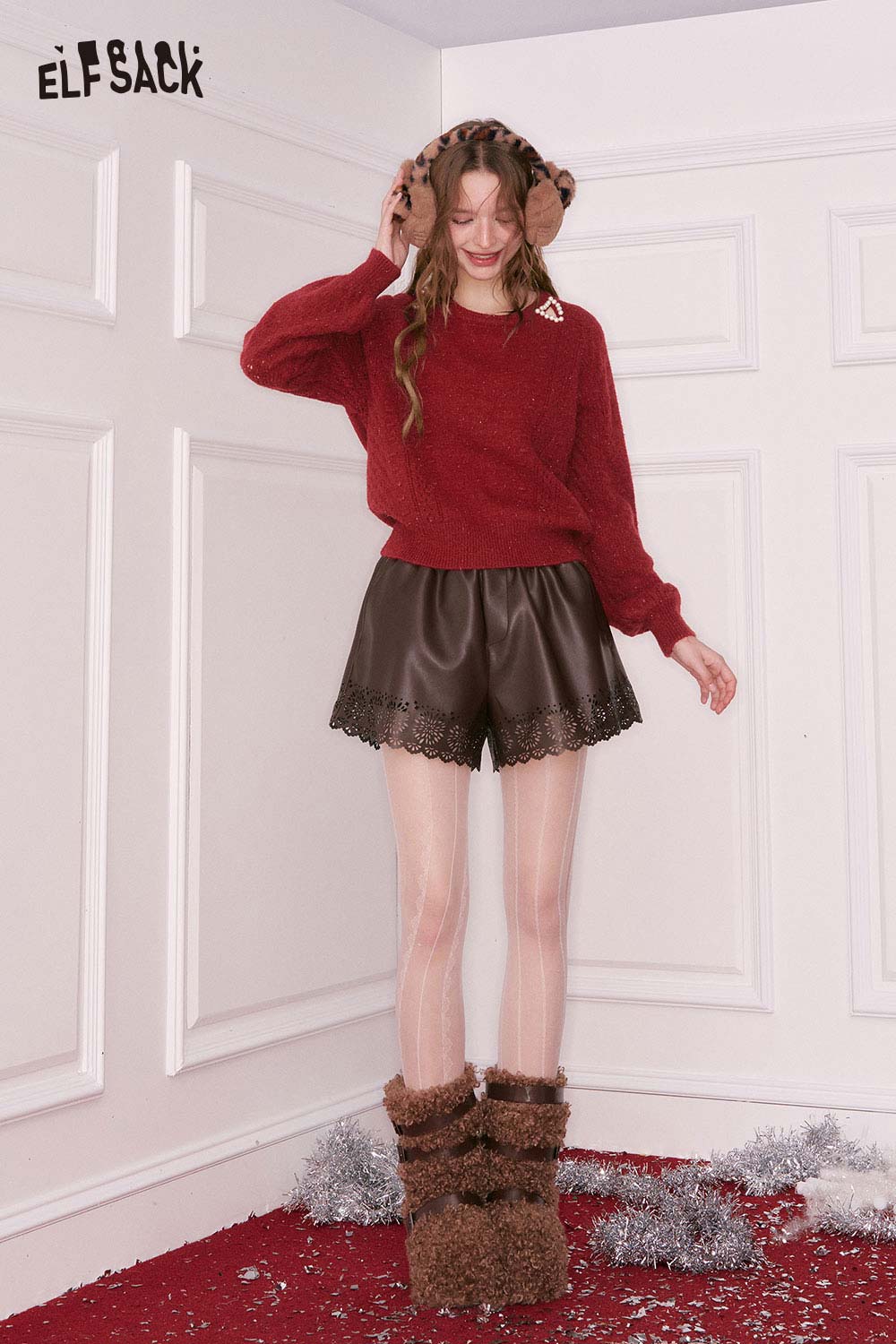ELFSACK pearl embellished cropped sweater in red paired with brown leather shorts for a stylish winter look
