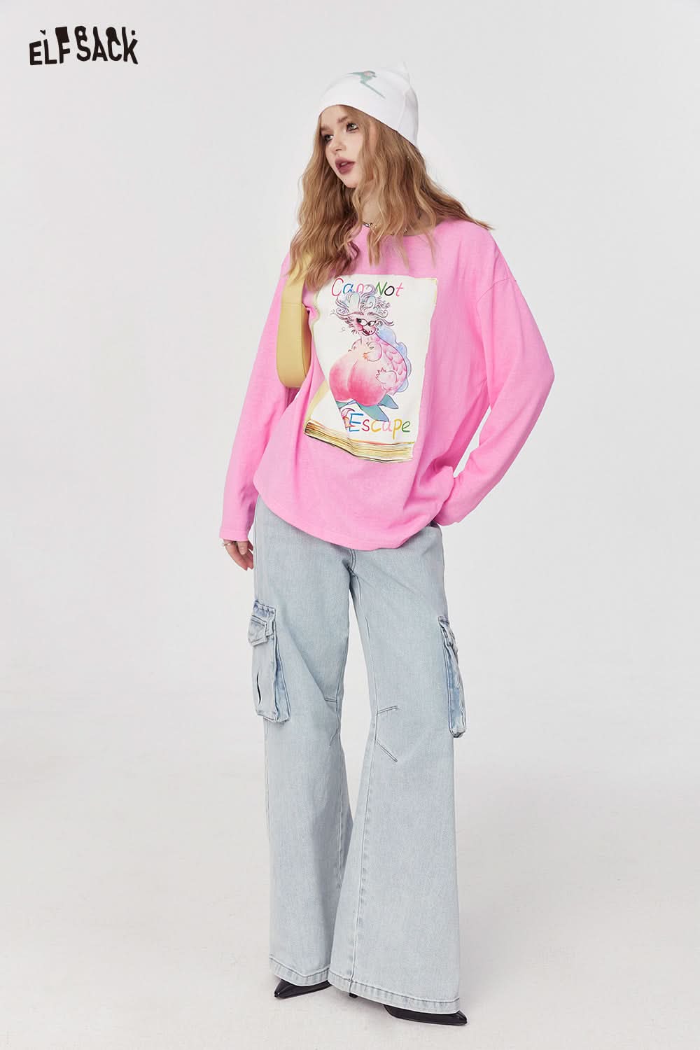ELFSACK pink oversized T-shirt with colorful graphic print worn with light blue cargo jeans and white beanie