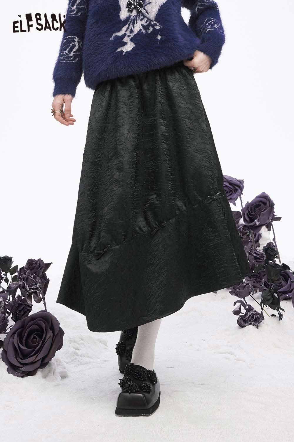 ELFSACK pleated A-line long skirt in black with a textured finish, perfect for stylish winter outfits