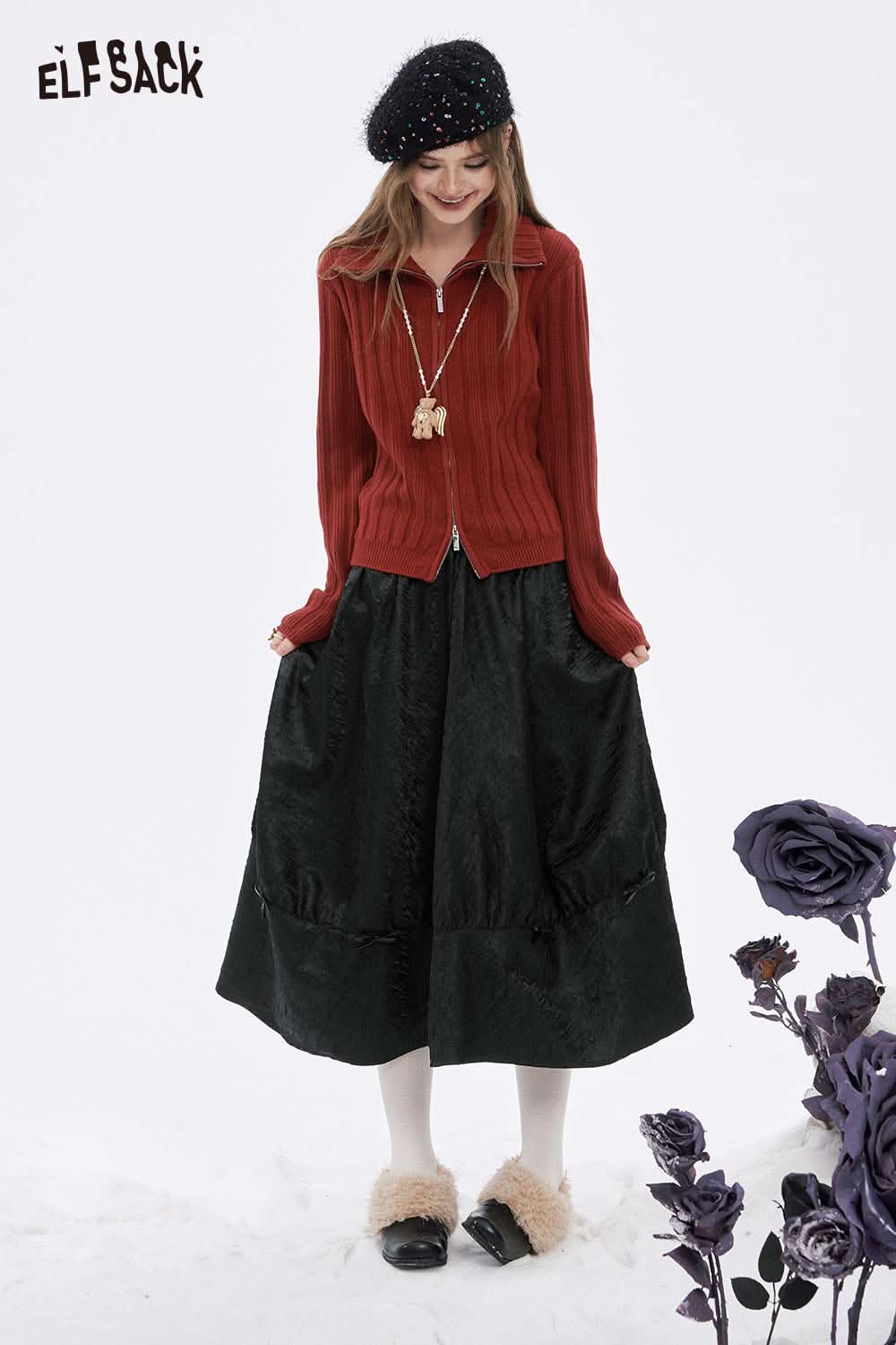 ELFSACK Pleated A-Line Long Skirt in Black, styled with a cozy red sweater and accessories