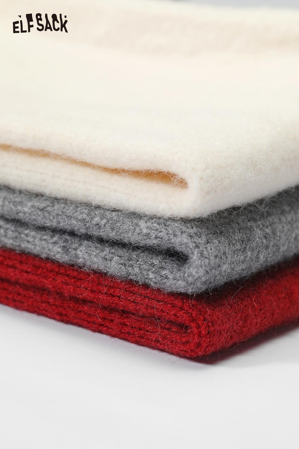 ELFSACK plush collar zip sweater for women in cream, gray, and red colors stacked neatly