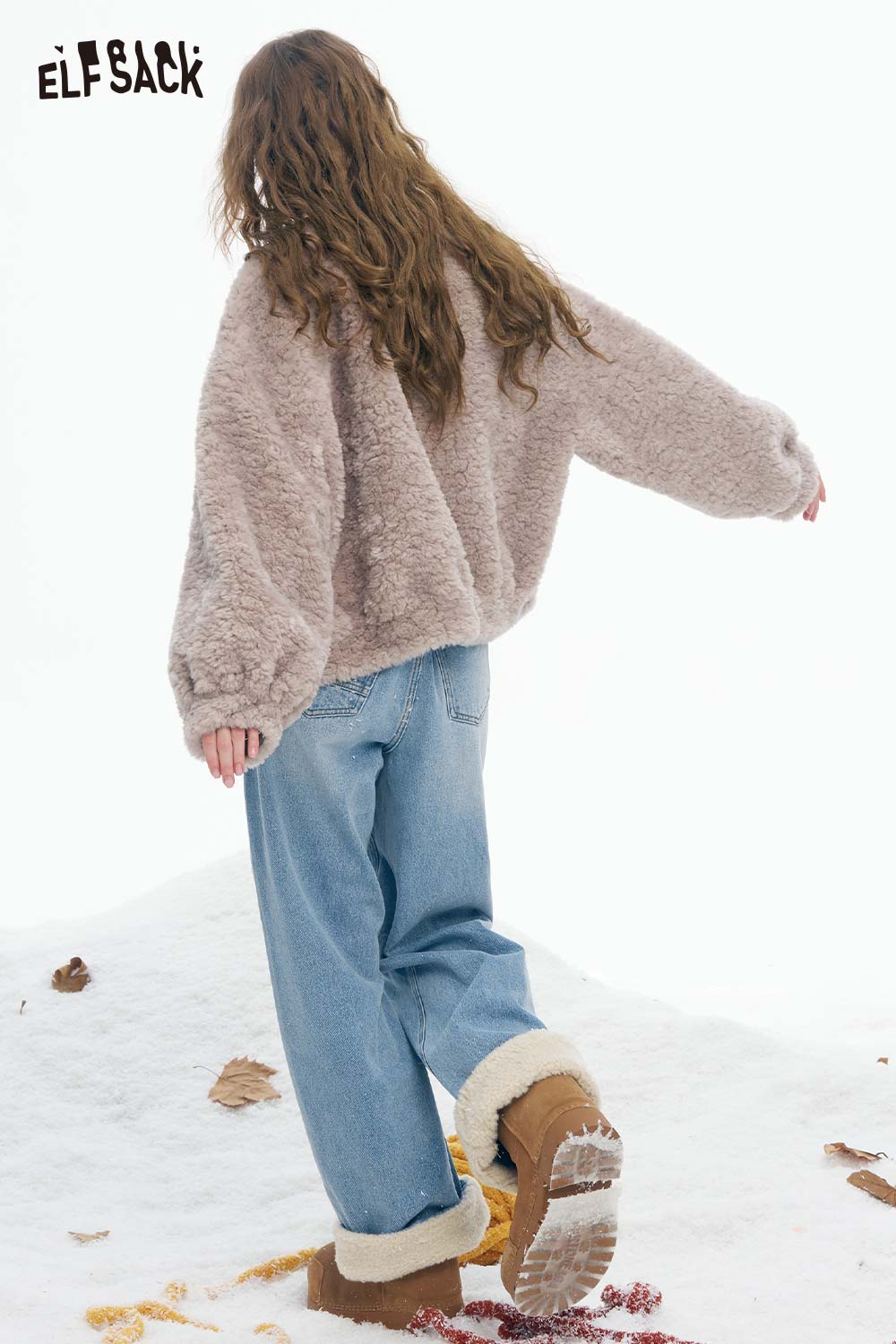 ELFSACK plush cuff straight jeans for women paired with a cozy sweater in a snowy setting
