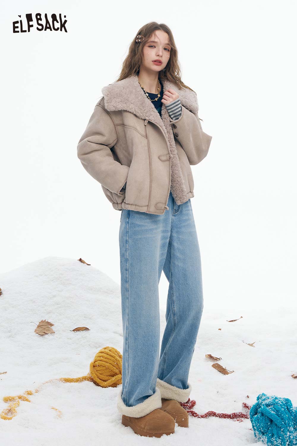 ELFSACK plush cuff straight jeans for women paired with a cozy, oversized jacket in winter setting