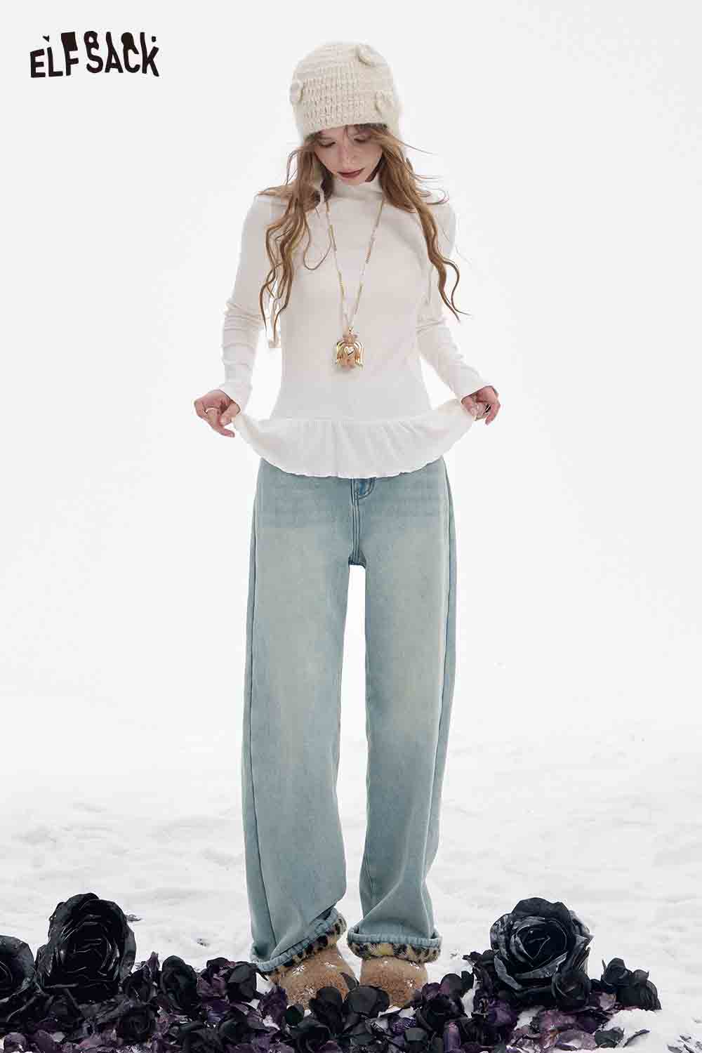 ELFSACK plush leopard lining floor length pants styled with a white top and knit hat on a snowy background