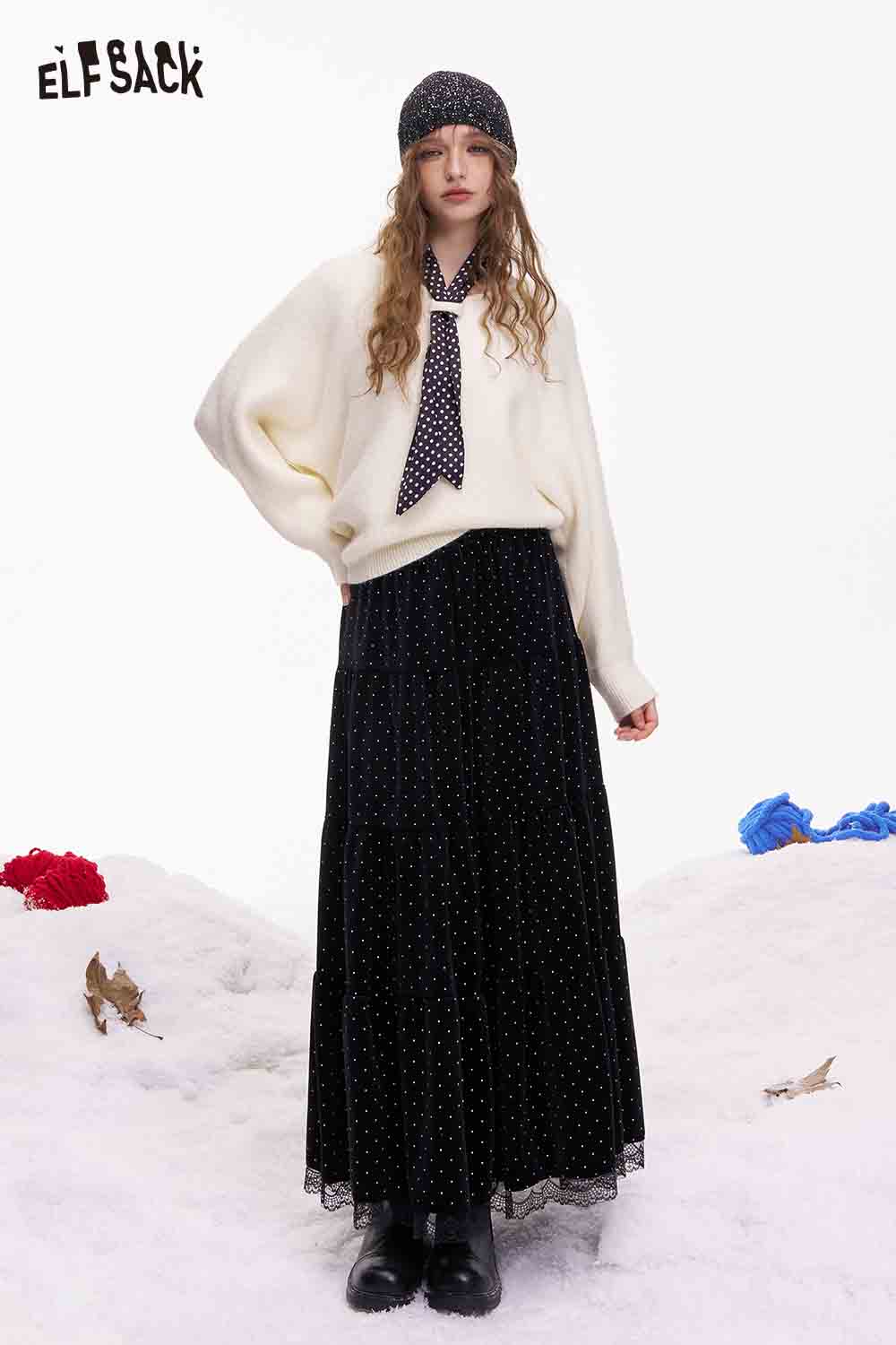 ELFSACK polka dot lace ruffle skirt styled with a cozy sweater and hat for a chic winter look