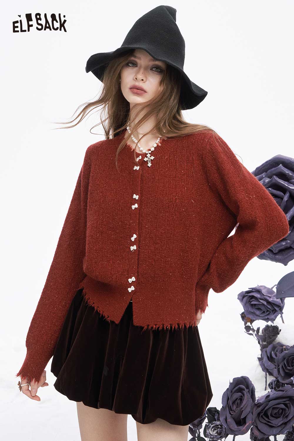 ELFSACK preppy fringe sweater for women in rust color, styled with a black hat and velvet skirt