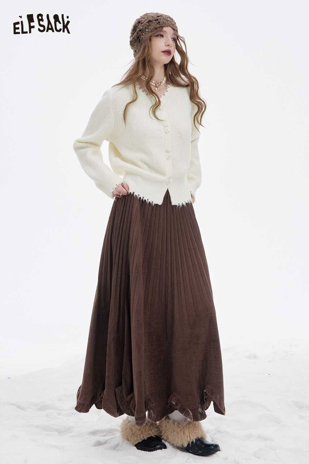 ELFSACK preppy fringe sweater for women styled with a brown pleated skirt in a winter setting