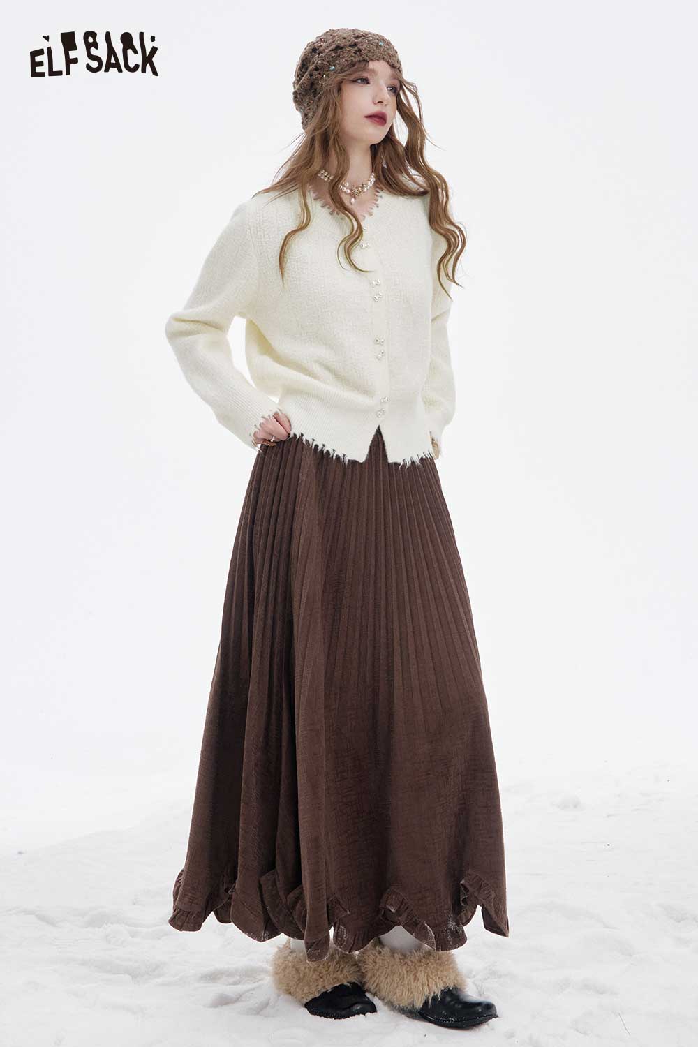 ELFSACK preppy fringe sweater for women styled with a brown pleated skirt in a winter setting