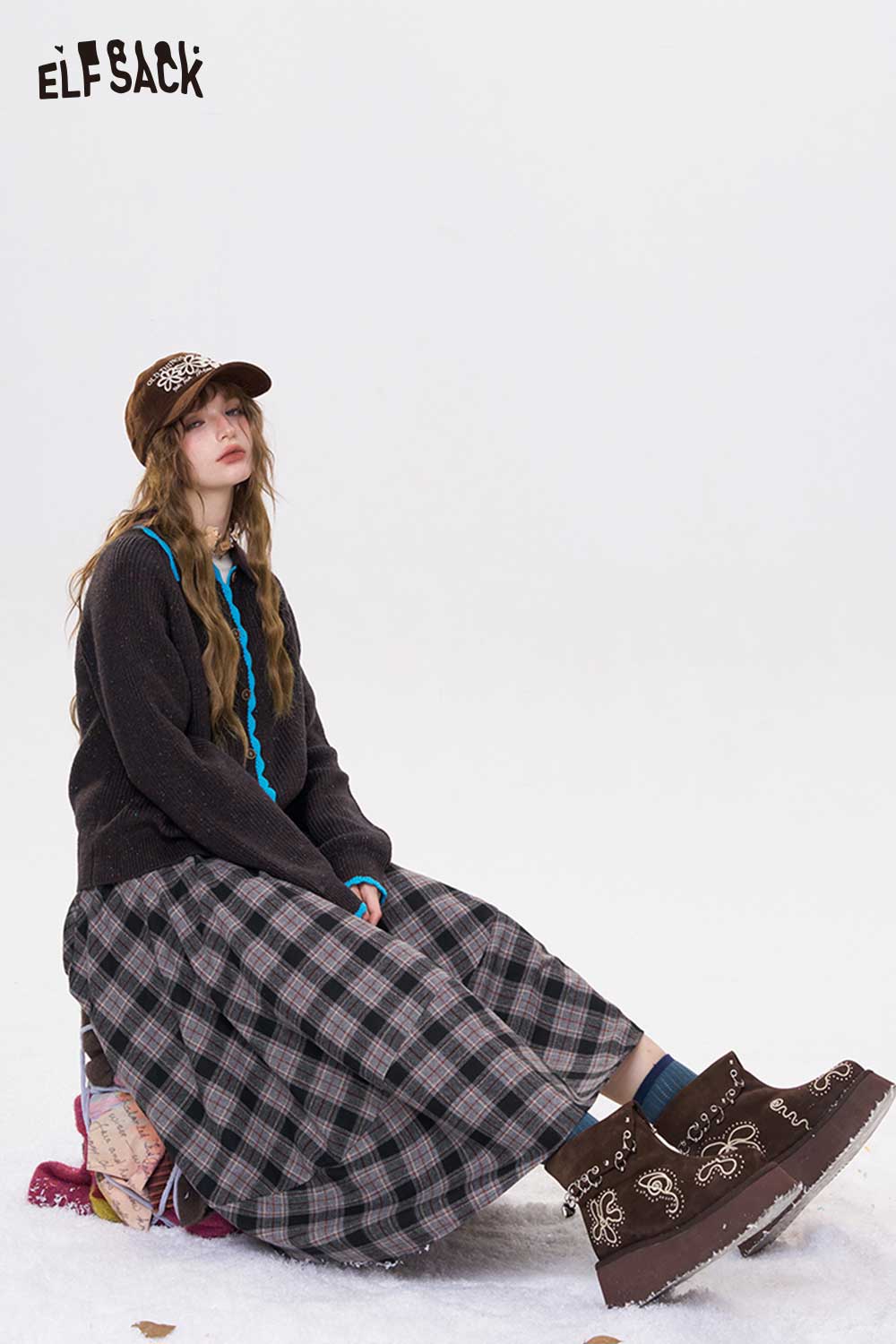 ELFSACK preppy knit cardigan for women styled with a plaid skirt and trendy accessories