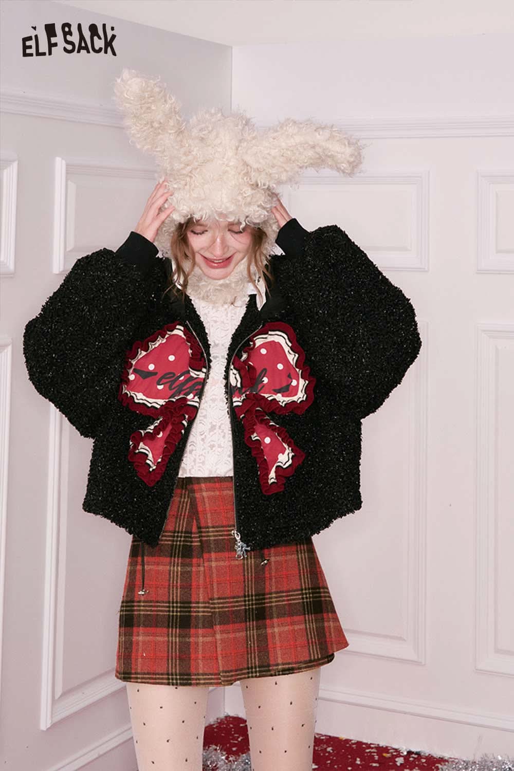 ELFSACK preppy red plaid culottes skirt styled with a fuzzy black jacket and bunny hat