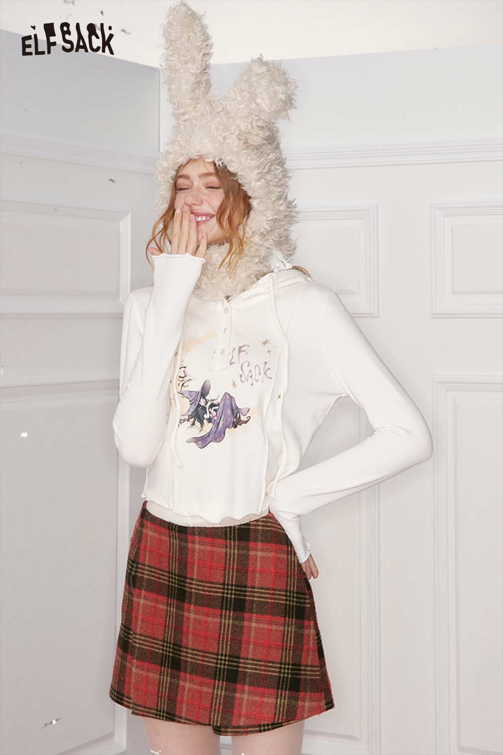 ELFSACK preppy red plaid culottes skirt styled with a cozy bunny hat and graphic crop top