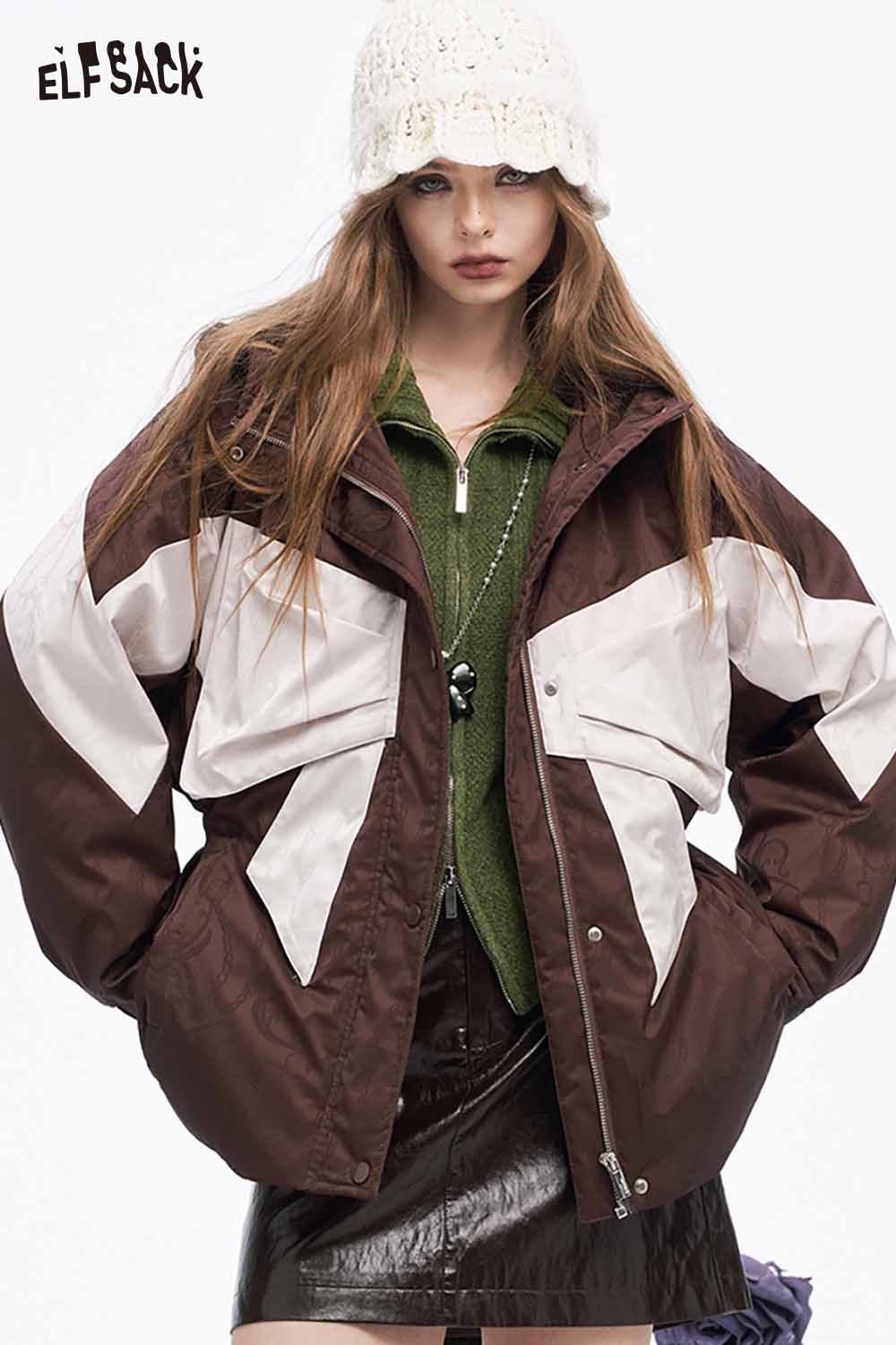 ELFSACK preppy zip up ribbed sweater layered under a stylish brown and white jacket