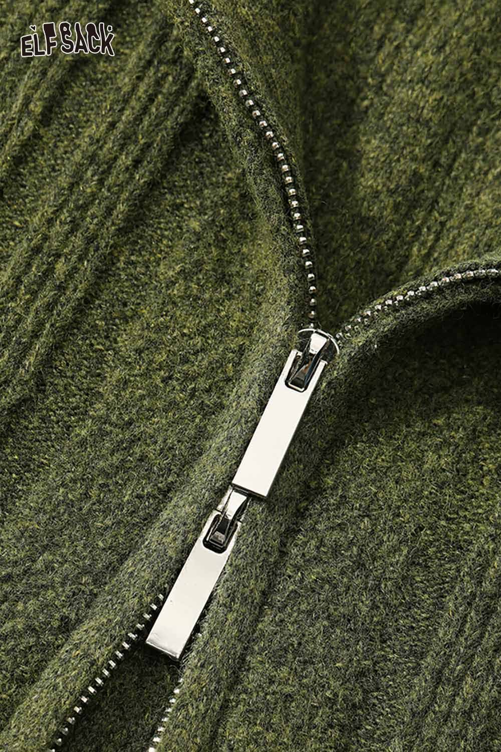 Close-up of a green preppy zip up ribbed sweater by ELFSACK showcasing the zipper detail.