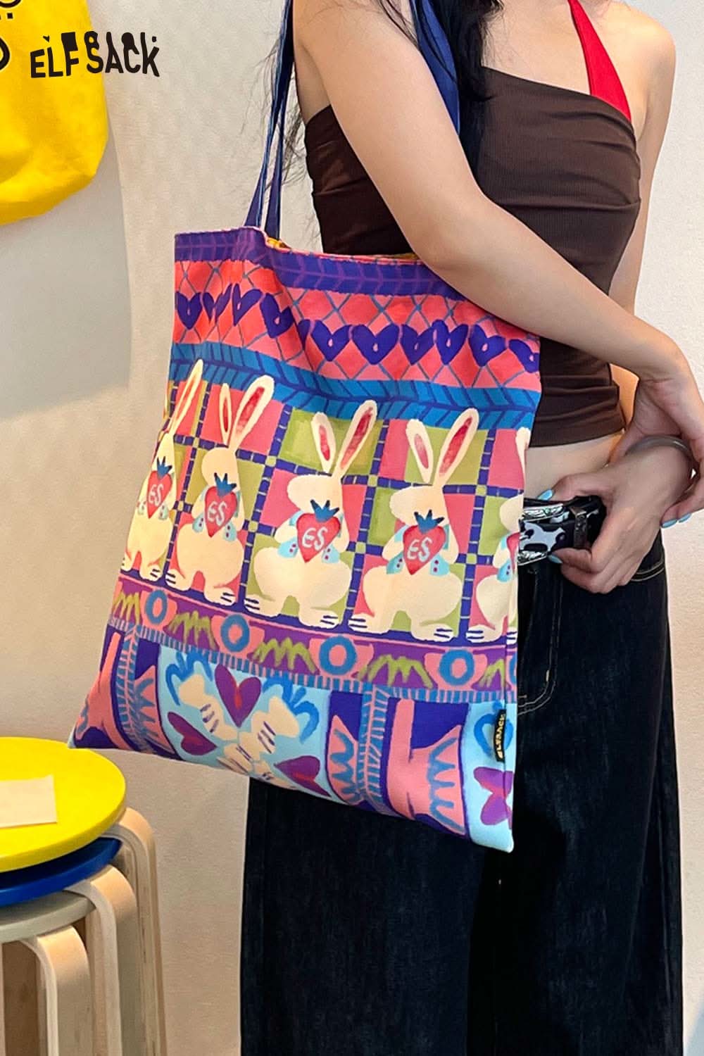 Colorful ELFSACK rabbit graphic tote bag featuring playful bunny designs and patterns