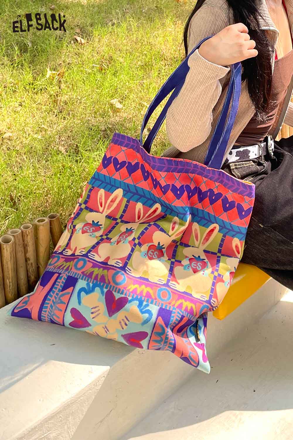 Colorful ELFSACK rabbit graphic tote bag featuring playful rabbit designs and sturdy straps