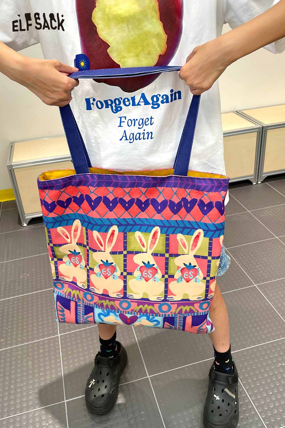 Colorful ELFSACK rabbit graphic tote bag featuring playful bunny designs and a spacious interior