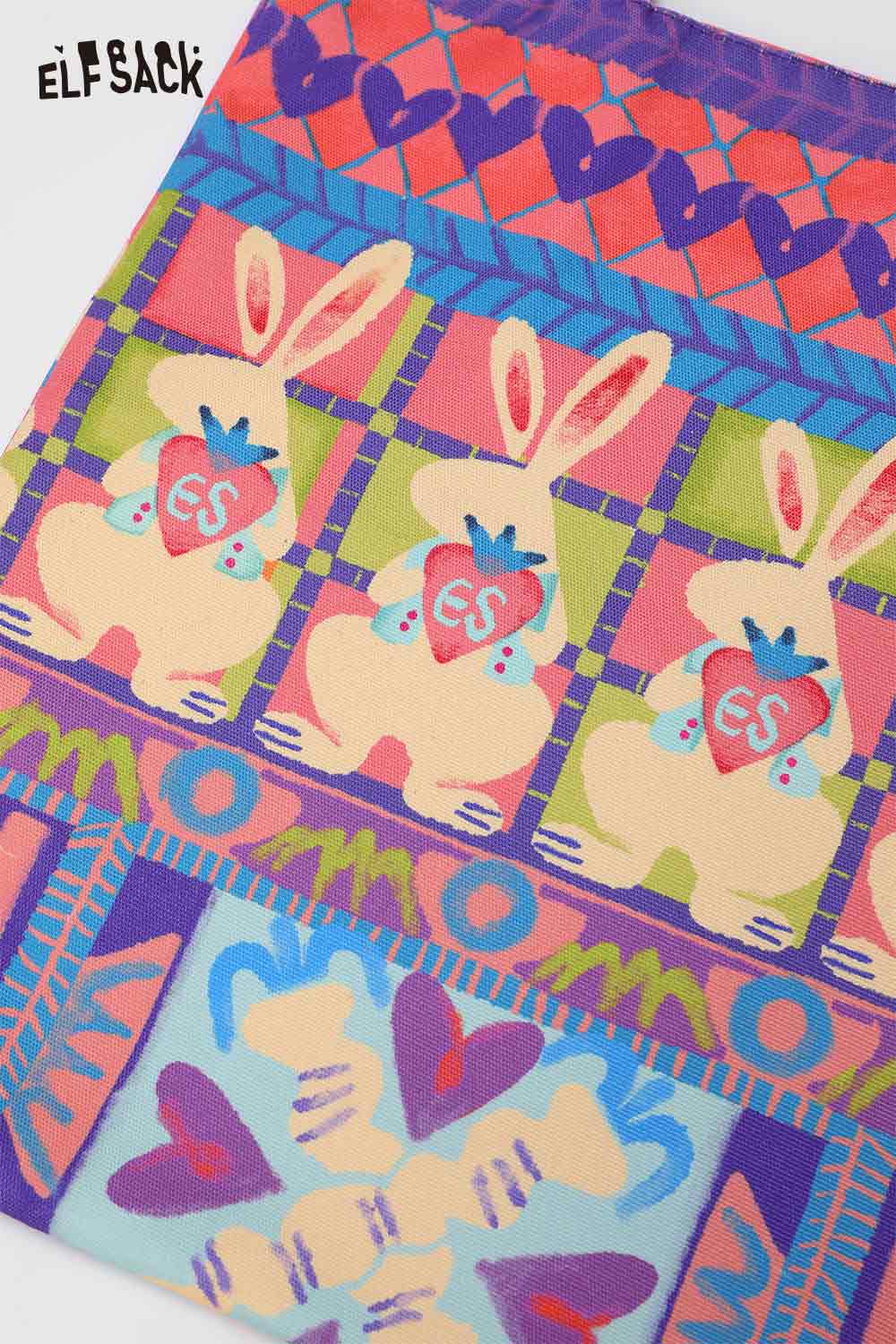 Colorful ELFSACK rabbit graphic tote bag featuring playful bunny designs and heart motifs