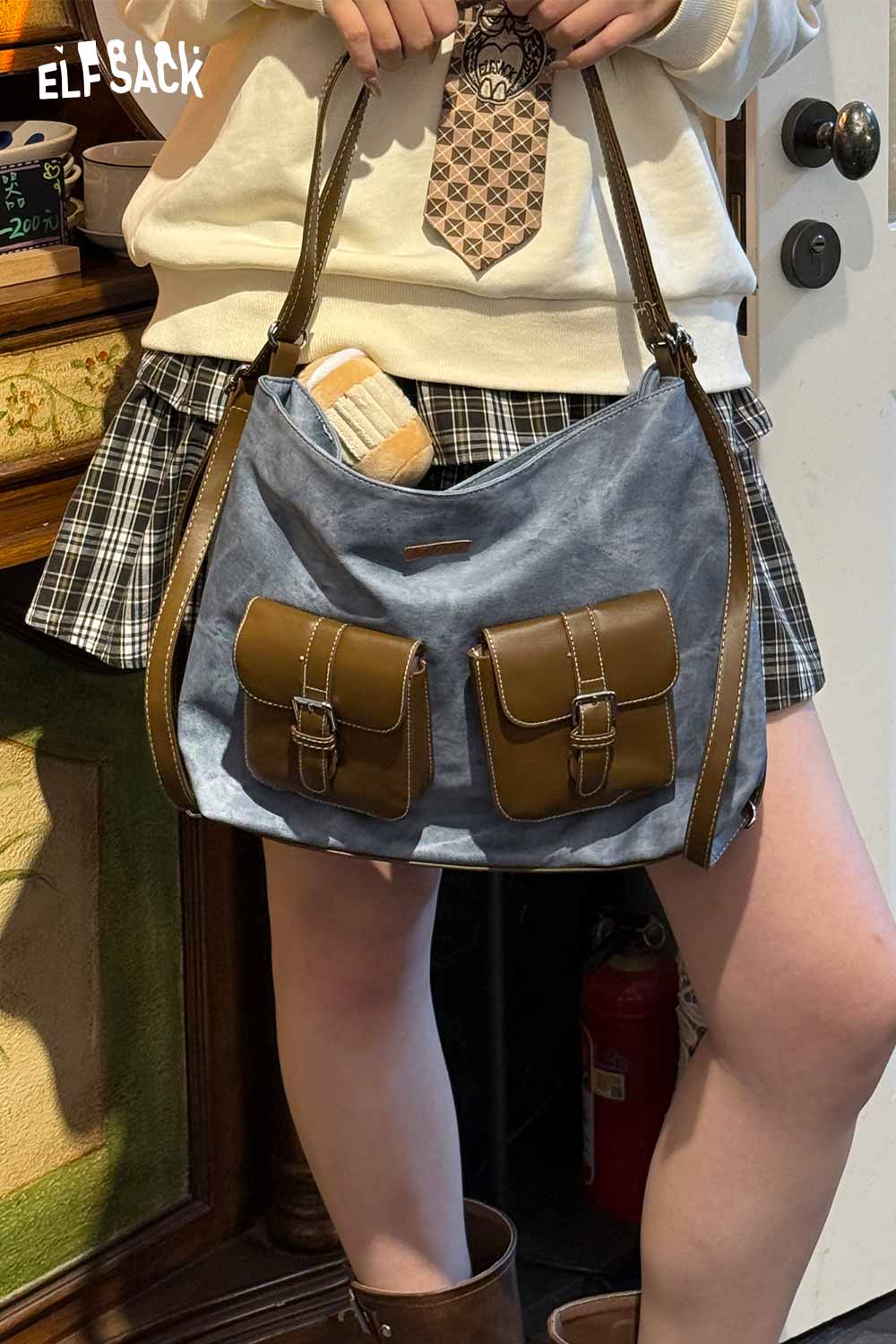 ELFSACK recycled faux leather crossbody bag in blue with brown buckle pockets for stylish versatility