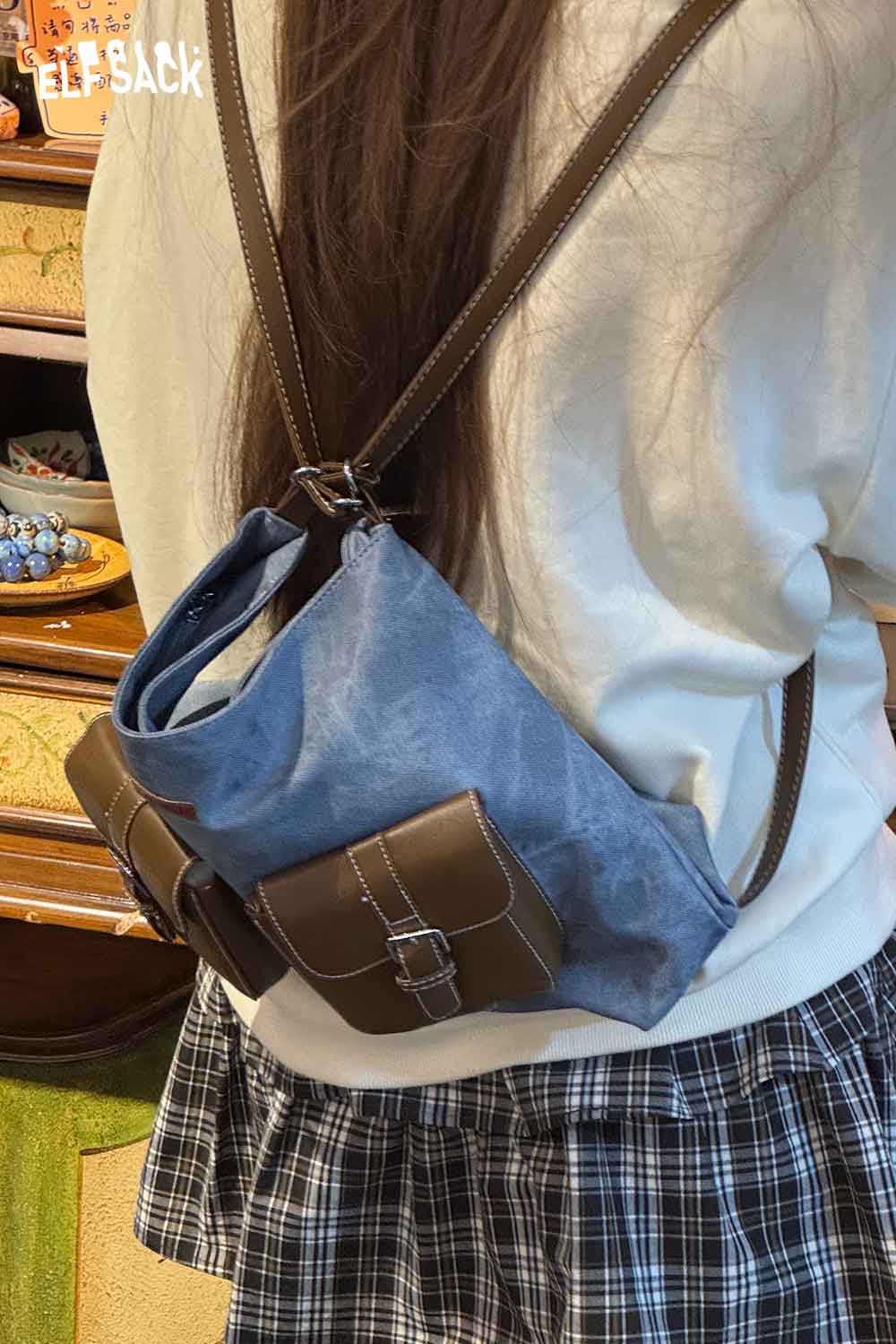 ELFSACK recycled faux leather crossbody bag in blue with adjustable straps for casual outings